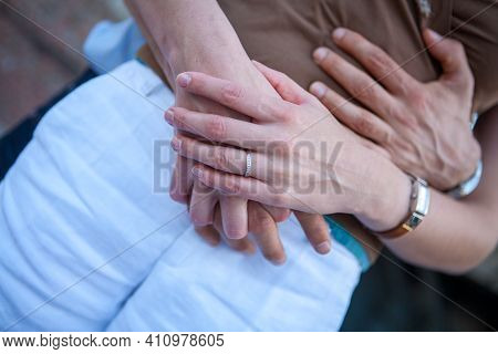 Loving Couple Holding Hands Close-up. Love Concept. High Quality Photo