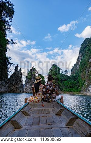Couple On Longtail Boat Visiting Khao Sok National Park In Phangnga Thailand, Khao Sok National Park