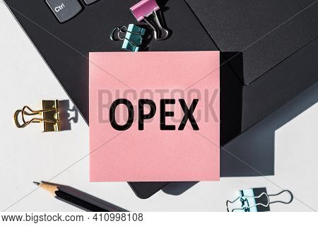 Opex Operational Expenditures Note Is Written On A Paper Sticker On A Laptop Keyboard.