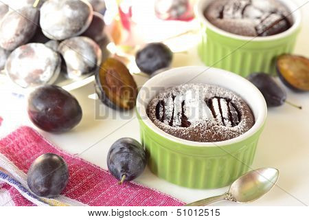 Clafoutis with plums and chocolate, selective focus