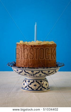 Chocolate Birthday Cake With Almond Flakes And Candle
