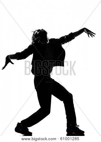 full length silhouette of a young man dancer dancing funky hip hop r&b zombie walk on isolated studio white background