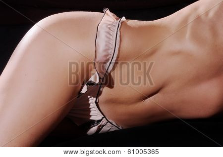 Torso of young caucasian woman on black  background