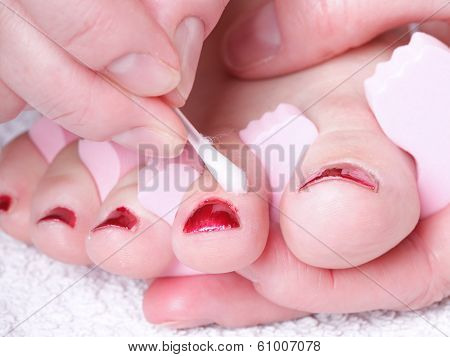 Female Feet Red Polished Nails