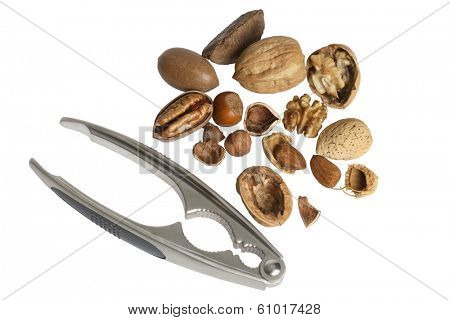 Various nuts and nut cracker on white background