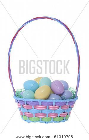 Colored Easter basket with solid color eggs on white background