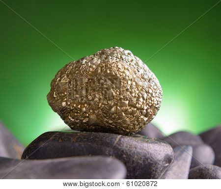 Iron pyrite also known as a fool's gold natural crystal on amethyst rock