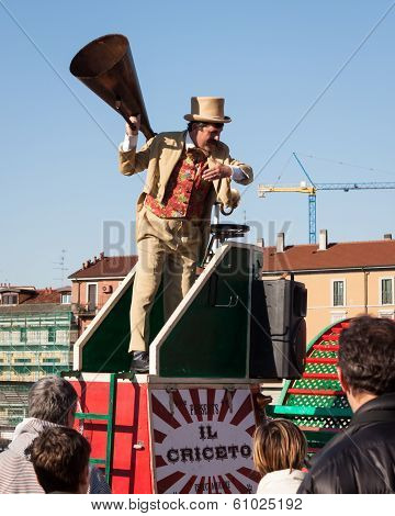 Performer Calls People Using A Vintage Loudhailer At Milan Clown Festival 2014