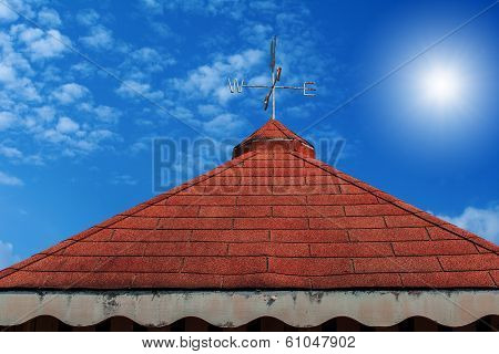Rooster weather vane on roof