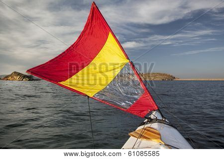 canoe bow with a downwind sail  on Horsetooth Reservoir in Colorado near Fort Collins