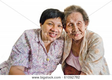 Family Portrait Of An Asian Elder Mother And Daughter Hugging In Isolated Background