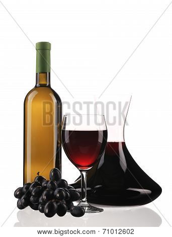 Decanter bottle and glass with red wine.