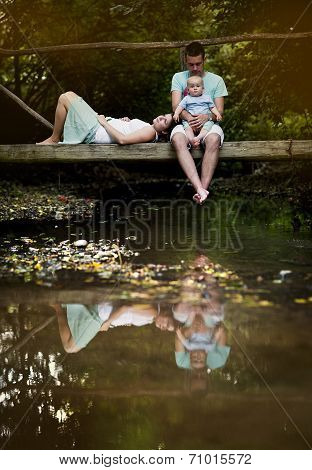 Happy family by the river