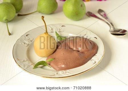 Poached pear with chocolate sauce