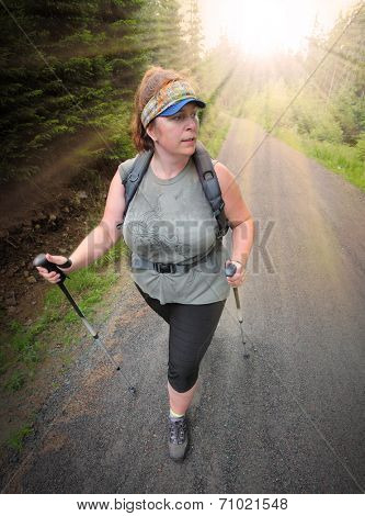 Overweight woman walking in nature. Healthy lifestyle and weight loss concept.