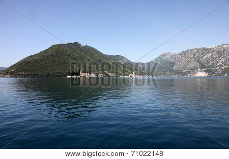 PERAST, MONTENEGRO - JUNE 08: The Church of St. George (left) and Dome of the Rock (right). Perast in Bay of Kotor, Montenegro, on June 08, 2012 