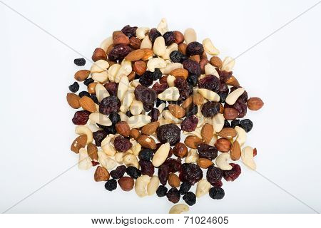 mixed nuts and dried fruits isolated on white background