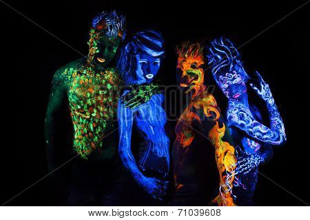 Body art glowing in ultraviolet light