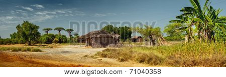 Panorama with wooden buildings along the road. Madagascar