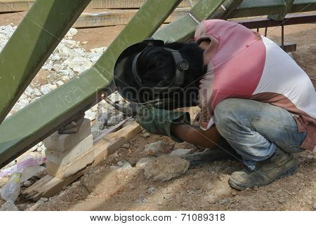 Welder with protective mask welding metal