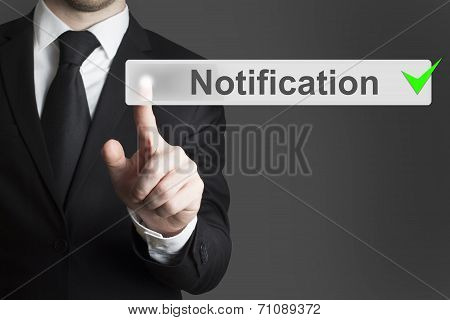 Businessman Pushing Button Notification