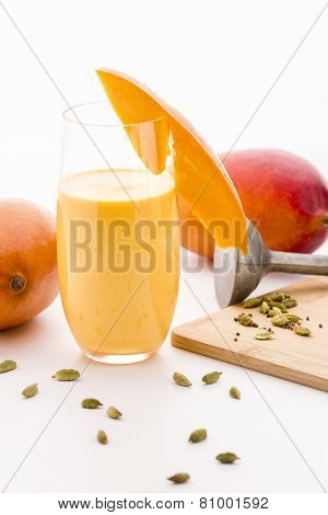 Decorated Mango Milk Shake And Crushed Cardamon