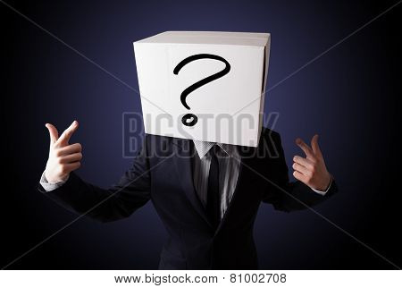 Businessman standing and gesturing with a cardboard box on his head with question mark
