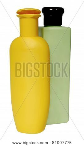 colored plastic bottles with liquid soap and shower gel.