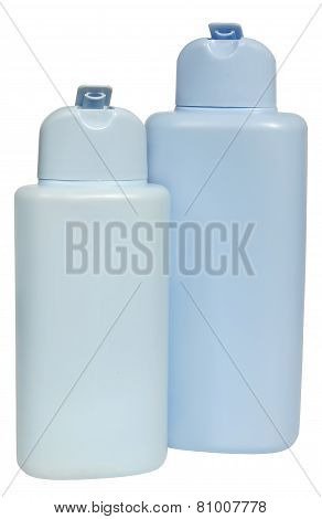 colored plastic bottles with liquid soap and shower gel.