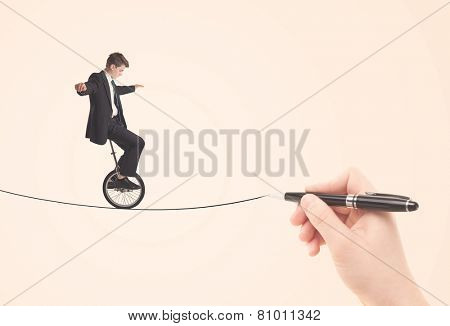 Businessman riding monocycle on a rope drawn by hand concept