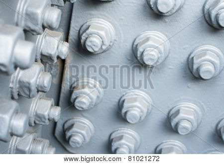 Gray Painted Metal Surface With Bolts And Nuts