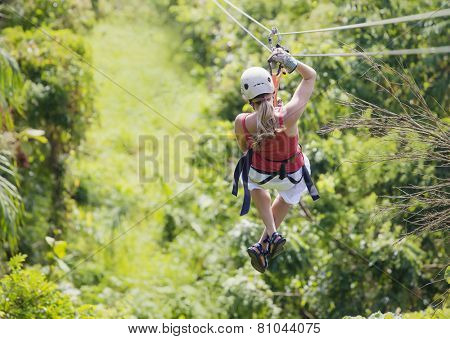 Woman going on a jungle zipline adventure