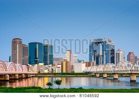 Osaka, Japan skyline at Umeda from across the Yodogawa River.