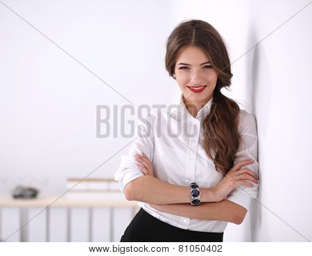 Attractive businesswoman with her arms crossed stnding