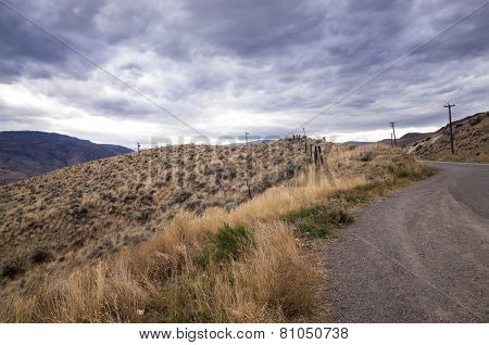 Grey Storm Clouds Gathering Over A Mountain