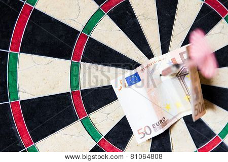 Dartboard With Steeldarts And Euro In It
