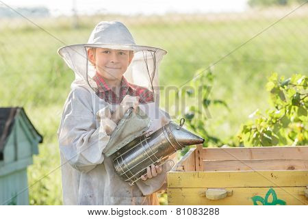 Teenage Beekeeper Wearing Protective Clothing