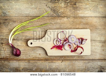 Chopped red onion on a wooden board