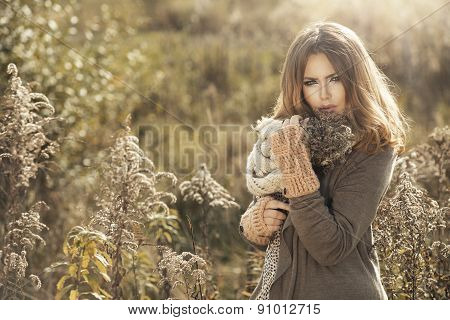 Young Girl  In Autumn Scenery