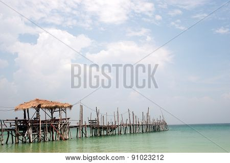 Traditional Wooden Bridge On The Beach.