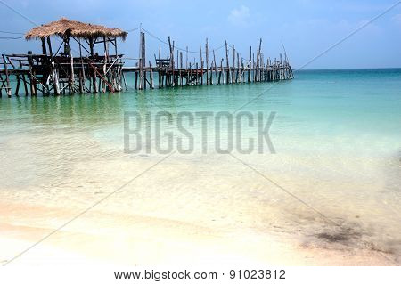 Traditional Wooden Bridge On The Beach.