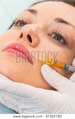 Subcutaneous injection into the girl's face