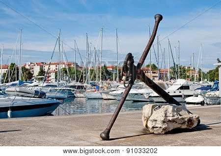 Old Anchor In The Marina Of Porec, Istria, Croatia.
