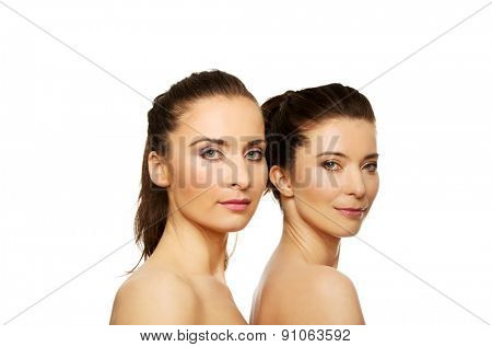 Two attractive sisters with make up.