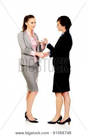 Caucasian businesswoman giving a plane to her partner.