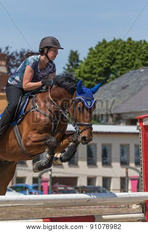 Closeup Of Horsewoman Jumping. Vertically.