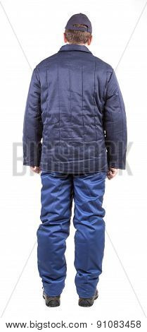 Worker in winter workwear. Back view.