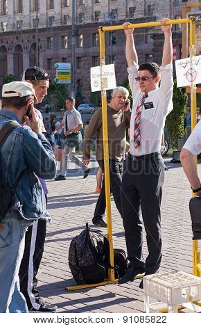 Ukraine, Kiev - May 27, 2013: Young Missionary Tries His Hand On The Power Amusement