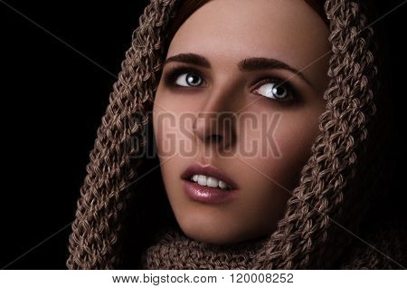 Portrait of a girl in a scarf-snood large knitted