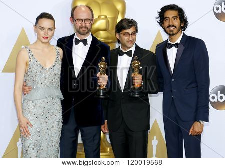 James Gay-Rees, Asif Kapadia, Dev Patel and Daisy Ridley at the 88th Annual Academy Awards - Press Room held at the Loews Hollywood Hotel in Hollywood, USA on February 28, 2016.